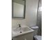 Bathroom featuring updated tile shower, white vanity, and modern mirror at 4417 De Forest St, Las Vegas, NV 89103