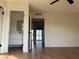 A bright bedroom showcases light wood flooring and access to the bathroom and sunny balcony, enhancing appeal at 4417 De Forest St, Las Vegas, NV 89103