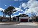 Charming single Gathering home with a two car garage, mature tree, and beautiful blue sky at 4417 De Forest St, Las Vegas, NV 89103