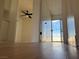 Hallway featuring clean white walls, hardwood floors, and access to an exterior sliding glass door at 4417 De Forest St, Las Vegas, NV 89103