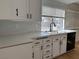 Bright kitchen featuring refinished cabinets, new countertops, and stainless sink at 4417 De Forest St, Las Vegas, NV 89103
