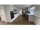 Modern kitchen with white cabinets, stainless steel appliances, and a view from the window at 4417 De Forest St, Las Vegas, NV 89103
