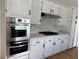 Bright kitchen featuring refinished cabinets, new countertops, and stainless oven at 4417 De Forest St, Las Vegas, NV 89103