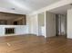 Open living room featuring wood floors, brick fireplace and open access to other rooms at 4417 De Forest St, Las Vegas, NV 89103