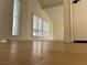 Open living room with neutral walls, modern flooring, and plenty of natural light at 4417 De Forest St, Las Vegas, NV 89103