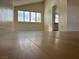Bright living room with hardwood floors, window shutters, and an open floor plan at 4417 De Forest St, Las Vegas, NV 89103