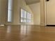 Bright living room featuring wood floors, vaulted ceilings and shuttered windows at 4417 De Forest St, Las Vegas, NV 89103