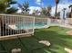 Backyard oasis with a private pool and well-maintained artificial grass at 4417 De Forest St, Las Vegas, NV 89103