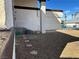 Side yard with low-maintenance gravel landscaping and stone pathway leading to front door at 4417 De Forest St, Las Vegas, NV 89103