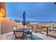 Outdoor balcony with a patio set, umbrella, and views of the surrounding landscape at 4752 Rancho Camino Ct, Las Vegas, NV 89129