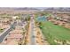 Expansive aerial shot featuring a golf course, water feature and desert landscape at 505 Punto Vallata Dr, Henderson, NV 89011