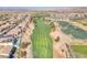 Wide aerial view of a golf course neighborhood, showcasing the greenery and surrounding residences at 505 Punto Vallata Dr, Henderson, NV 89011
