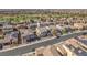 Scenic aerial view of a residential area with tree-lined streets, and manicured lawns, offering a sense of community at 505 Punto Vallata Dr, Henderson, NV 89011