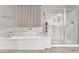 Luxurious primary bathroom with soaking tub, walk-in shower, and clean aesthetic at 505 Punto Vallata Dr, Henderson, NV 89011