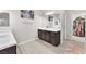 Bathroom with double vanity, walk in closet, and neutral décor at 505 Punto Vallata Dr, Henderson, NV 89011