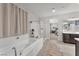 Elegant bathroom featuring a soaking tub, walk-in shower, and dual sink vanity for a spa-like retreat at 505 Punto Vallata Dr, Henderson, NV 89011