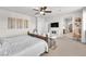 Relaxing primary bedroom with a ceiling fan, television, and stylish décor at 505 Punto Vallata Dr, Henderson, NV 89011