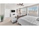 Bright and airy primary bedroom with natural light, ceiling fan, and stylish décor at 505 Punto Vallata Dr, Henderson, NV 89011