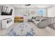 Open concept bonus room featuring a modern couch, flat screen television, and neutral tones at 505 Punto Vallata Dr, Henderson, NV 89011