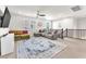 A bright and airy bonus room with a view of the staircase and large windows at 505 Punto Vallata Dr, Henderson, NV 89011