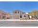 Charming stucco home featuring a three-car garage, landscaped yard, and a welcoming facade at 505 Punto Vallata Dr, Henderson, NV 89011