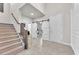 Spacious foyer featuring a staircase, tile flooring, and an open layout at 505 Punto Vallata Dr, Henderson, NV 89011