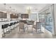 Modern kitchen with a spacious island, sleek countertops, and adjacent seating area, perfect for Gathering gatherings and entertaining at 505 Punto Vallata Dr, Henderson, NV 89011