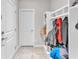 Welcoming mudroom space with tiled floors, built in cubbies and coat racks, great for organization at 505 Punto Vallata Dr, Henderson, NV 89011