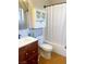 Bathroom with a shower/tub and wood vanity sink and mirror with a mounted cabinet at 5117 Eldora Ave # 4, Las Vegas, NV 89146