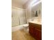 Bathroom featuring a shower with glass doors, and a wooden vanity at 5117 Eldora Ave # 4, Las Vegas, NV 89146