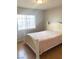 Bedroom featuring a large window with blinds and light wooden furniture at 5117 Eldora Ave # 4, Las Vegas, NV 89146