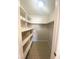 Walk in closet with installed wooden shelving at 5117 Eldora Ave # 4, Las Vegas, NV 89146