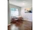 Bright dining room with wood floors and a view to the outside at 5117 Eldora Ave # 4, Las Vegas, NV 89146