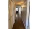 Hallway with wood floors and white trim with a closet on the left side at 5117 Eldora Ave # 4, Las Vegas, NV 89146