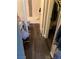 Bathroom area, showcasing a tub, toilet, vanity and wood-look flooring at 5220 Mission Carmel Ln # 103, Las Vegas, NV 89107