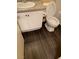 A bathroom featuring a neutral color palette and wood look flooring at 5220 Mission Carmel Ln # 103, Las Vegas, NV 89107
