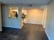 A light-filled living space showing an open layout with a kitchen view and wood-look flooring at 5220 Mission Carmel Ln # 103, Las Vegas, NV 89107