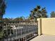 A peaceful balcony view shows the beautiful palm trees and manicured community landscape at 5309 Luna Bonita St, Las Vegas, NV 89113