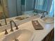 Bathroom with double sink vanity, large mirror, and contemporary fixtures at 5309 Luna Bonita St, Las Vegas, NV 89113