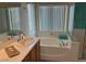 Bright bathroom featuring a soaking tub, separate shower, and vanity with counter space at 5309 Luna Bonita St, Las Vegas, NV 89113