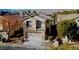 Charming two-story home with a well-maintained front yard and an attached two-car garage at 5309 Luna Bonita St, Las Vegas, NV 89113