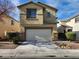 Inviting two-story home featuring a two-car garage and landscaped front yard, perfect for suburban living at 5309 Luna Bonita St, Las Vegas, NV 89113