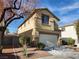 Two-story home with a two-car garage, desert landscaping and neutral color palette at 5309 Luna Bonita St, Las Vegas, NV 89113