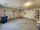 Attached two-car garage offering convenient parking, garage door, and space for a workbench at 5309 Luna Bonita St, Las Vegas, NV 89113