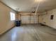A spacious two car garage features tire marks on the floor and is ready for use at 5309 Luna Bonita St, Las Vegas, NV 89113
