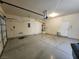 Two-car garage featuring an automatic door opener, side door access, and room for vehicle parking at 5309 Luna Bonita St, Las Vegas, NV 89113