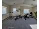 Home gym equipped with weights and equipment for a complete fitness routine at 5309 Luna Bonita St, Las Vegas, NV 89113