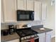 Gourmet kitchen featuring stainless steel appliances and gas range at 5309 Luna Bonita St, Las Vegas, NV 89113