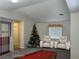 Cozy living room featuring a decorative Christmas tree, neutral walls, and comfortable seating at 5309 Luna Bonita St, Las Vegas, NV 89113