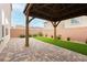 Backyard featuring a gazebo on a brick patio next to a patch of artifical grass at 5384 Knitmore Ct, Las Vegas, NV 89139
